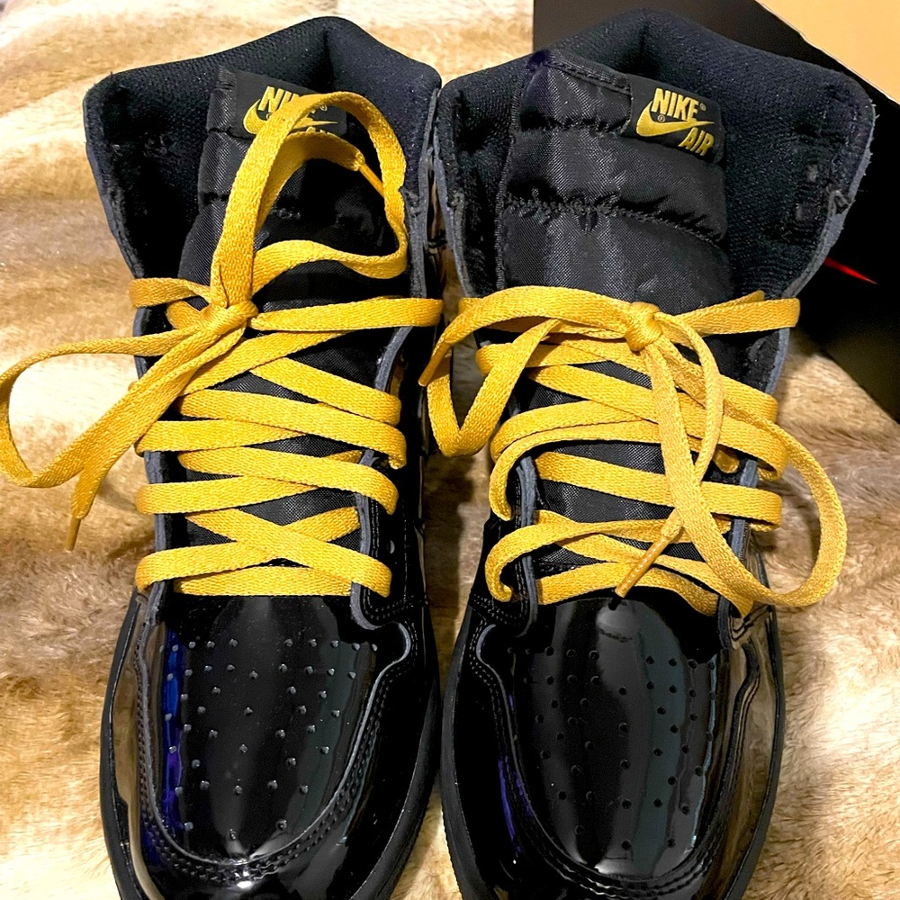 Black and metallic gold Jordan 1s
